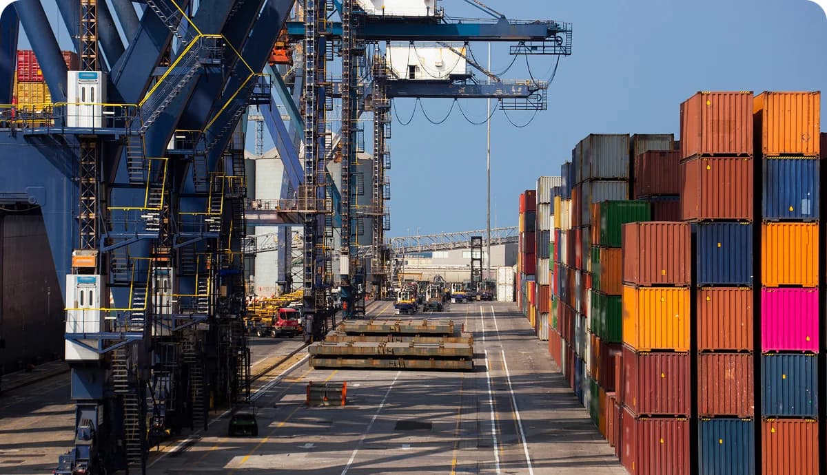 Manzanillo port with cranes and import containers from China